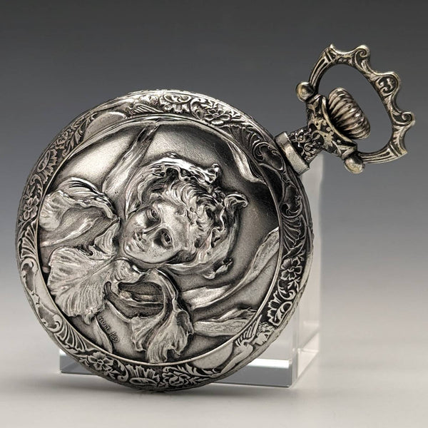 Antique Swiss made unsigned pocket watch with embossed silver plate case works well